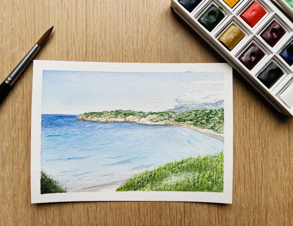Watercolor landscape of a beach in Crete, Greece.